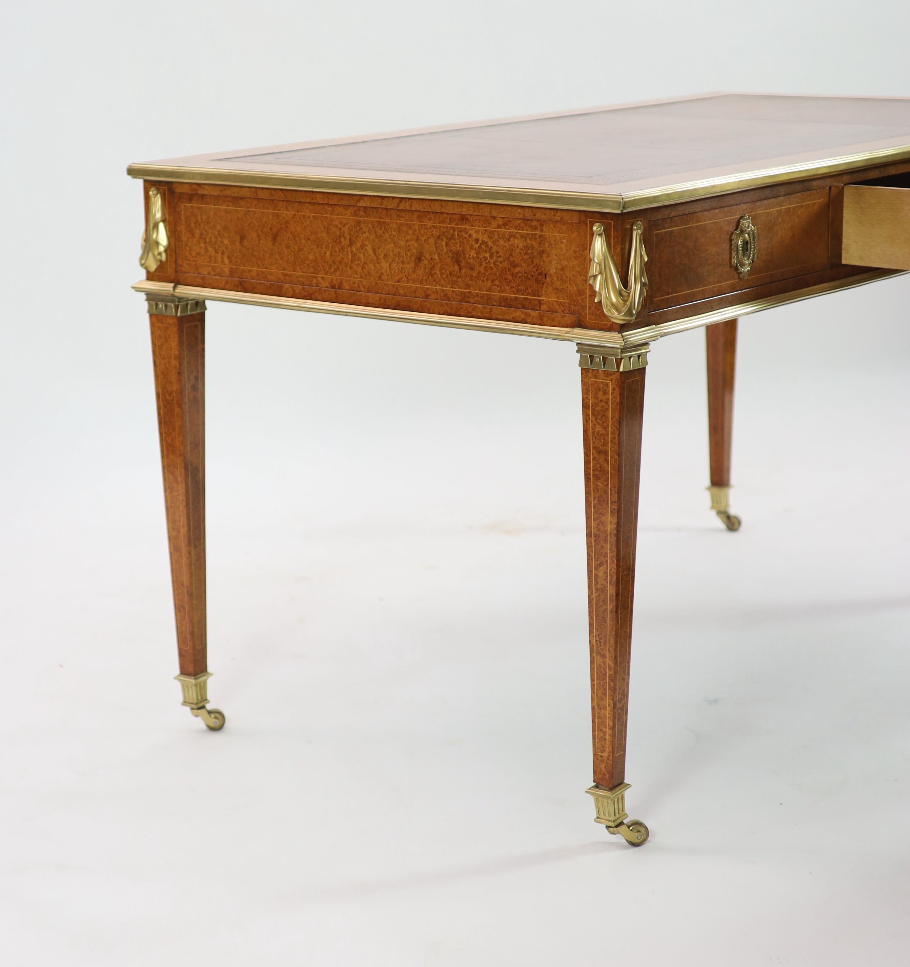 Laporte Barmen. A Louis XVI style ormolu mounted burr wood bureau plat, W.142cm D.76cm H.77cm